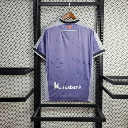 Camisola Real Sociedad 2025-26 Alternativa Azul Versão Adepto