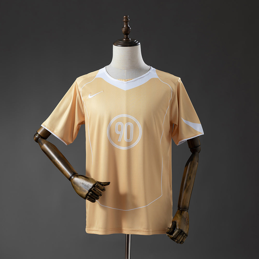 Camisola N.I.K.E. Total90 2025-26 Amarela