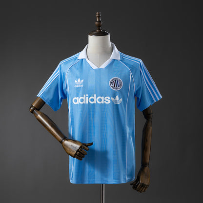 Camisola A.D.I.D.A.S. 2025-26 Originals Classic Three Stripes Azul Clara