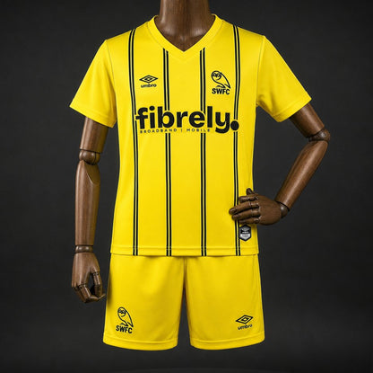 Kit Criança SHE-WED 2026-27 Alternativo Amarelo
