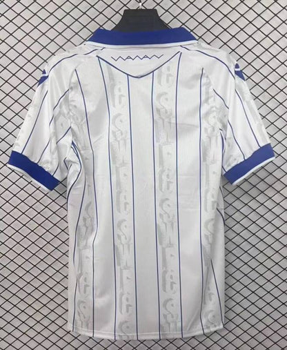 Camisola SHE-WED 2025-26 Alternativa Branca Versão Adepto