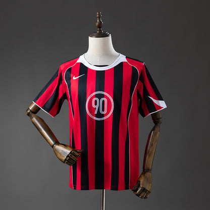 Camisola N.I.K.E. Total90 2025-26 Vermelha/Riscas