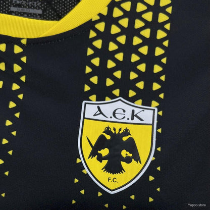 Camisola AEK Atenas 2025-26 Alternativa Preta Versão Adepto
