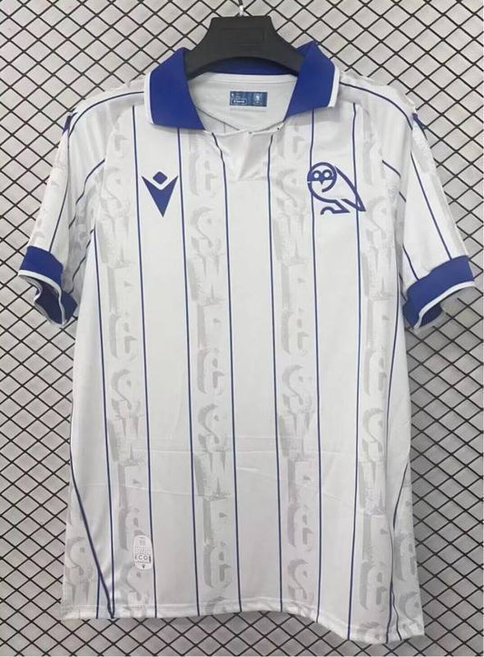 Camisola SHE-WED 2025-26 Alternativa Branca Versão Adepto