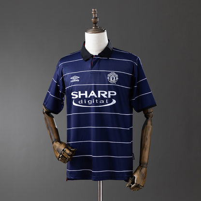 Camisola M-UNITED 1999-00 Alternativa Azul Versão Adepto