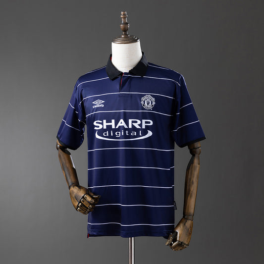 Camisola M-UNITED 1999-00 Alternativa Azul Versão Adepto